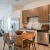 kitchen with stainless steel appliances and a table with chairs
